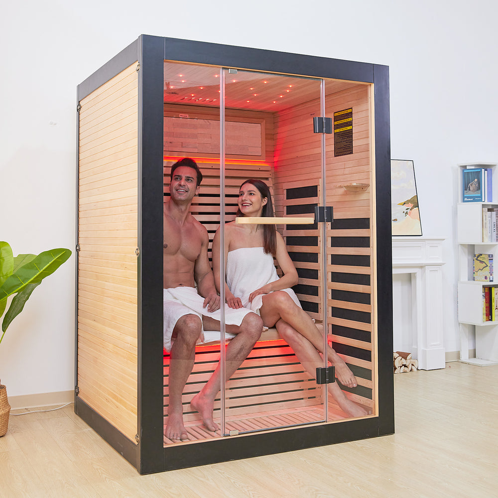 A couple sitting in the HK2 Outexer infrared sauna A couple sitting in the HK2 Outexer infrared sauna