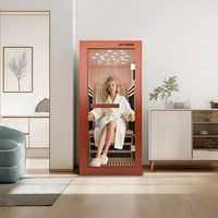A Woman sitting inside a infrared sauna with 'OUTEXER' branding, reflected in a mirror. A Woman sitting inside a infrared sauna with 'OUTEXER' branding, reflected in a mirror.