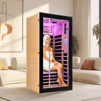A female model sitting inside a single sauna indoor A female model sitting inside a single sauna indoor