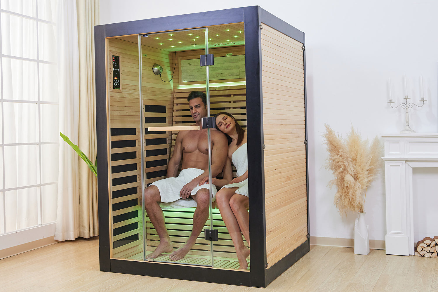 Two people inside a modern sauna with wooden interior and glass door.