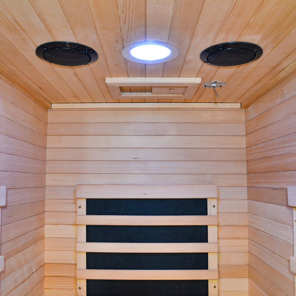HY-MINI outexer sauna with two speakers and a ceiling light inside.