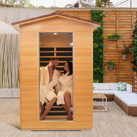 A couple sitting in Outexer HY2 enjoying the sauna in the yard