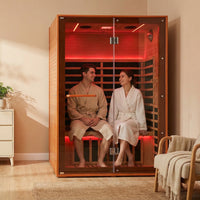 A couple sitting in a 2-person sauna