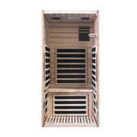 Wooden sauna with black interior panels on a white background