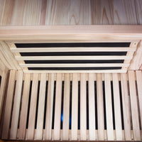 Wooden sauna with steam generator visible inside