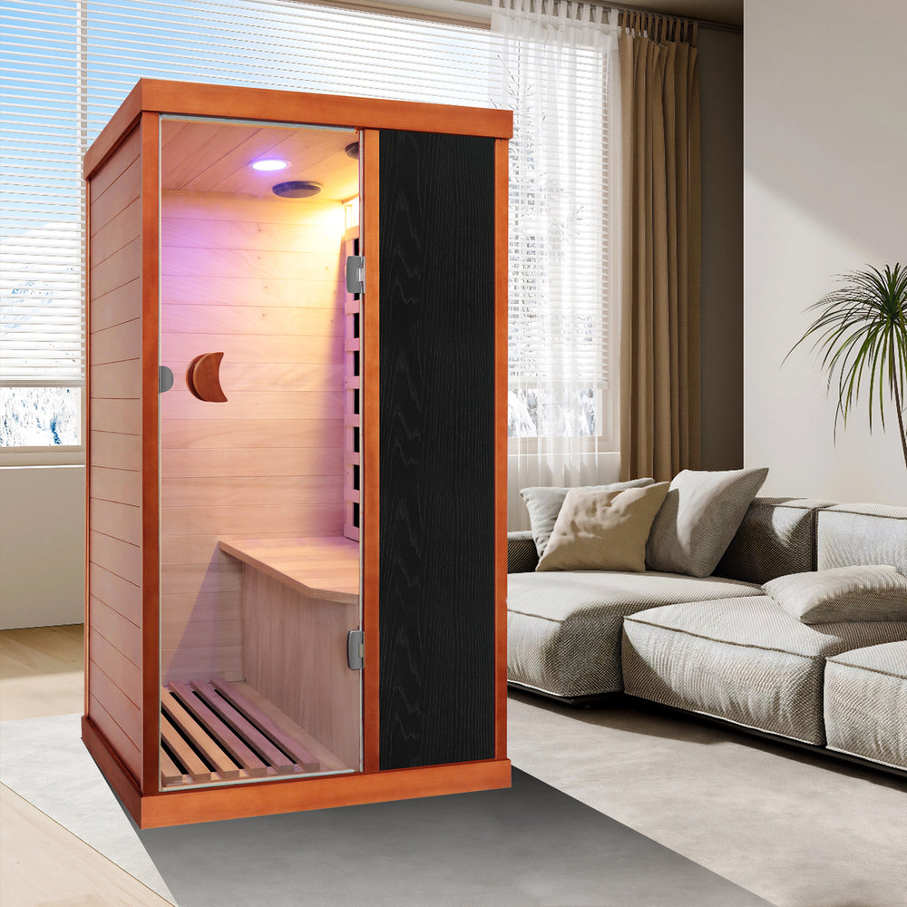 Outexer T-50C5 Infrared sauna in a modern living room with a sofa and window blinds.