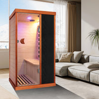Outexer T-50C5 Infrared sauna in a modern living room with a sofa and window blinds.