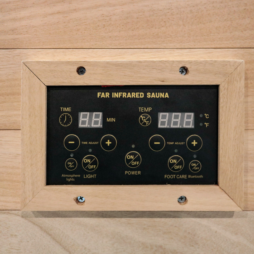 Control panel of Outexer T-50C5 far infrared sauna with digital display and wooden frame.