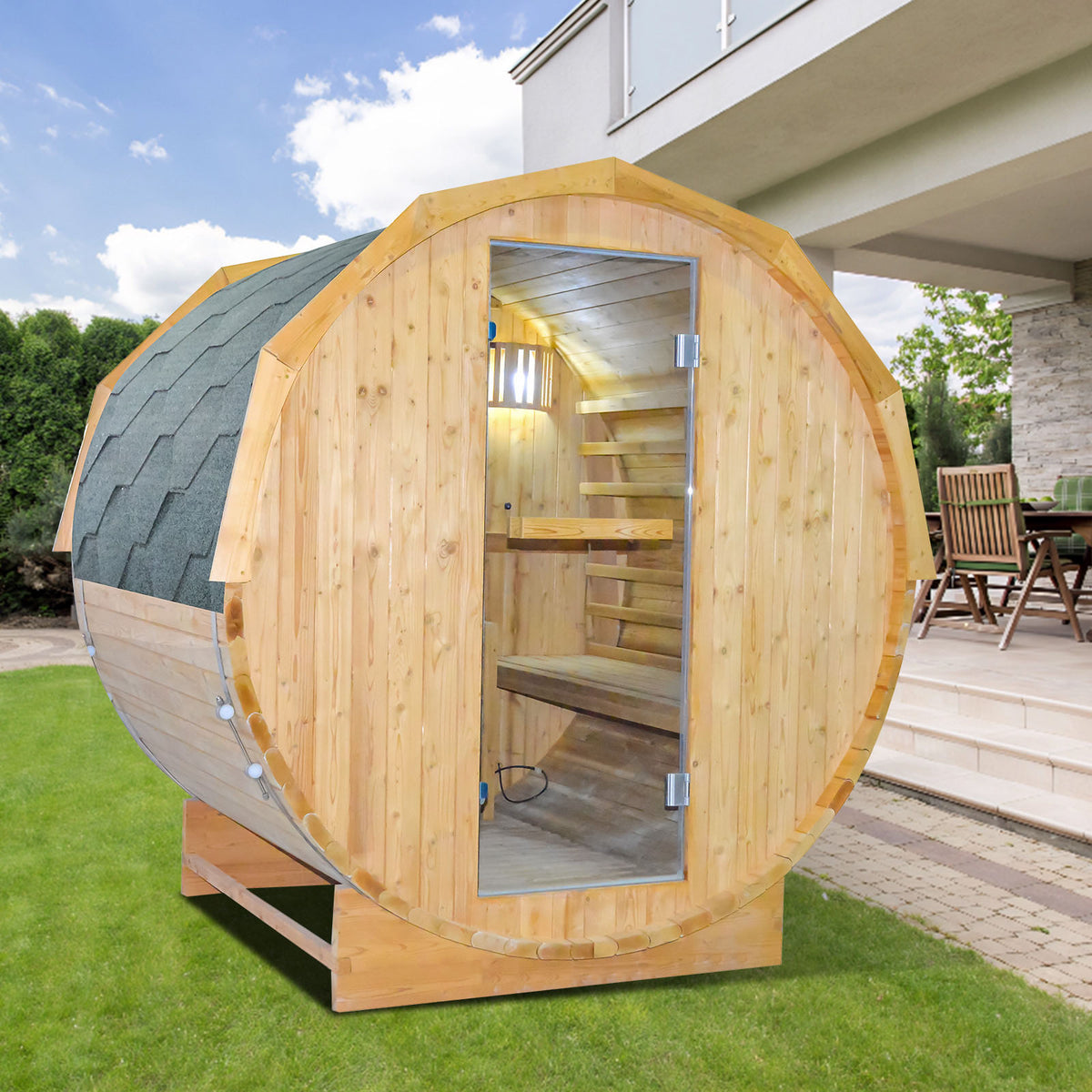 Wooden outdoor barrel sauna with glass door on a grassy area